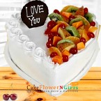 send half kg heart shaped vanilla fruit cake delivery