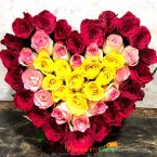 send red pink yellow roses heart shape arrangement delivery
