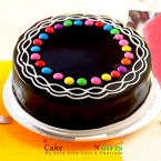 send half kg eggless gems chocolate truffle cake delivery