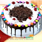 send Half Kg Cadbury Gems Black forest Cake Round Shape delivery