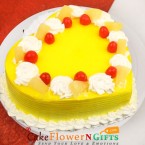 send 1kg eggless pineapple cake heart shape  delivery
