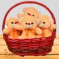 A basket full of 4 Teddies