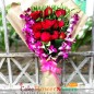 12 red roses and 4 purple orchids bouquet