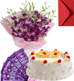 send Eggless Pineapple Cake Orchid Bouquet N Chocolate delivery
