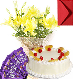 send Eggless Pineapple Cake Lilies Bouquet N Chocolate delivery