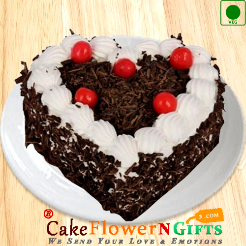 send Eggless Half kg heart shape black forest cake delivery