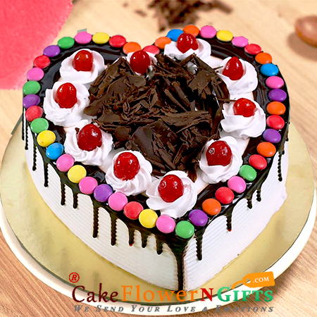 send 1kg black forest gems heart shape cake delivery