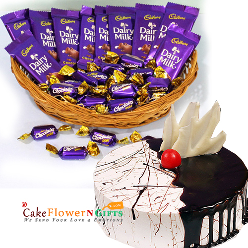 send 1kg choco vanilla cake with cadbury hamper delivery